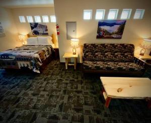 a hotel room with a bed and a couch at Bear Mountain Suite 10 in Grants Pass
