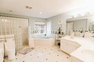 a large bathroom with a tub and a sink at Stunning Home, Sound View, Sauna and Covered Deck in Vashon