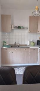 Küche/Küchenzeile in der Unterkunft L'Escapade Appartement T1 douillet tout confort