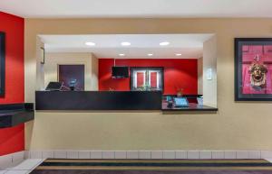 a lobby of a fast food restaurant with red walls at Extended Stay America Suites - Sacramento - Roseville in Roseville