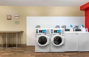 two washing machines and a table in a room at Extended Stay America Suites - Los Angeles - Long Beach Airport in Long Beach