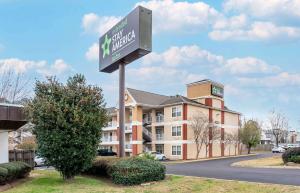 a sign for a hotel in front of a building at Extended Stay America Select Suites - Jackson - North in Jackson