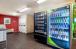 a soda machine in a store with soda bottles at Extended Stay America Suites - San Diego - Mission Valley - Stadium in San Diego