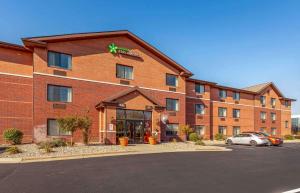a hotel with a car parked in front of it at Extended Stay America Select Suites - Madison - Old Sauk Rd in Madison