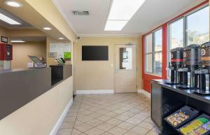 a lobby of a fast food restaurant with a waiting room at Extended Stay America Suites - Orange County - Irvine Spectrum in Irvine