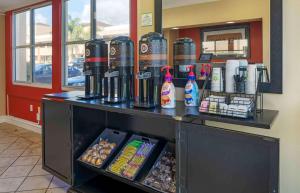 a counter in a fast food restaurant with condiments at Extended Stay America Suites - Orange County - Irvine Spectrum in Irvine