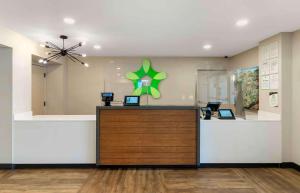 a lobby with a reception desk with two laptops on it at Extended Stay America Suites - San Jose - Milpitas - McCarthy Ranch in Milpitas