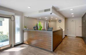 an office with a reception desk and a large window at Extended Stay America Suites - San Francisco - San Mateo - SFO in San Mateo