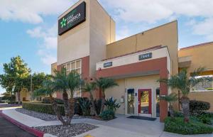 a walmart building with palm trees in front of it at Extended Stay America Suites - San Diego - Fashion Valley in San Diego