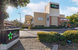 a building with a sign in front of it at Extended Stay America Suites - San Diego - Fashion Valley in San Diego