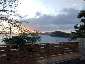 a view of the water from the deck of a house at Le Lointain in Mtsamboro