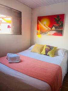 two beds sitting next to each other in a room at Vista Surf Pipa Hostel in Pipa