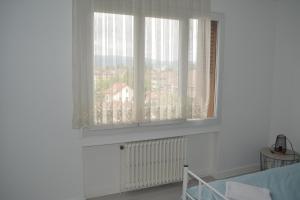 Łóżko lub łóżka w pokoju w obiekcie L'imperator