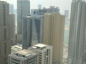 an aerial view of a city with tall buildings at شقة البحيره in Sharjah