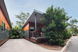 a house with a porch on the side of it at NRMA South West Rocks Holiday Park in South West Rocks