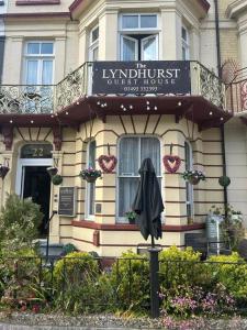 a building with a sign on the front of it at The Lyndhurst Guest House in Great Yarmouth