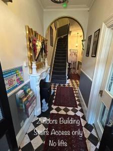 a hallway with a spiral staircase with a stairwayyrinth at The Lyndhurst Guest House in Great Yarmouth