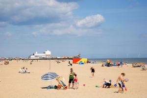 a group of people on the beach at the beach at The Lyndhurst Guest house in Great Yarmouth