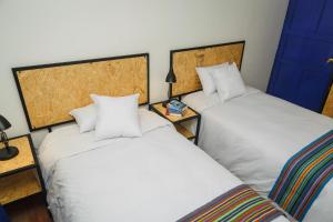 Cama o camas de una habitación en Saqray Hostel