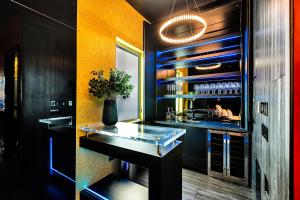 a bar with a glass counter in a room at SW Beach Hotel in Hermosa Beach