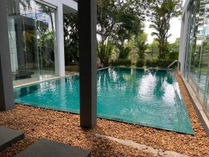 a swimming pool in the middle of a house at R Degrees Villa - Nawala in Nawala