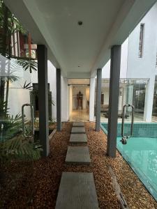 a hallway of a house with a swimming pool at R Degrees Villa - Nawala in Nawala