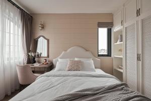 Postel nebo postele na pokoji v ubytování Davilla Đà Lạt Villa Collection