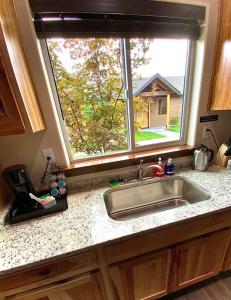 a kitchen counter with a sink and a window at Bear Mountain - Suite 1 in Grants Pass