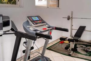 a gym with a scale on a treadmill at Ebrina One Bedroom in Port Harcourt