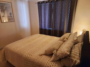 Ένα ή περισσότερα κρεβάτια σε δωμάτιο στο The Golfers Rest.