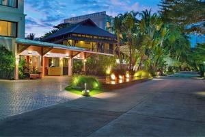 a house with a walkway in front of a building at Marriott's Mai Khao Beach - Phuket in Mai Khao Beach