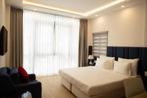 Posteľ alebo postele v izbe v ubytovaní Ruby Hotel