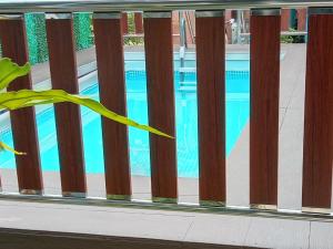 a view of a swimming pool from a balcony at A&P Inn Homestay in Kampong Pek