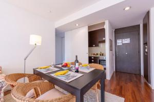 a dining room and kitchen with a table and chairs at Lugano Centro- Happy Rentals in Lugano