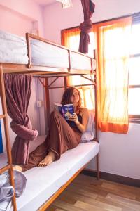 Letto o letti a castello in una camera di Planet Nomad Hostel