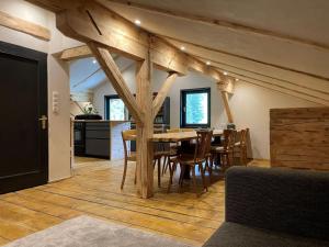 a kitchen and dining room with a table and chairs at Chalet in Mayrhofen near Ski Slopes in Mayrhofen
