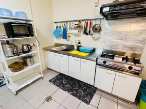A cozinha ou kitchenette de 郵系空間民宿