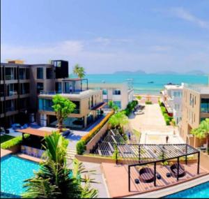 an aerial view of a resort with a swimming pool at Panwa Beach Side in Phuket Town