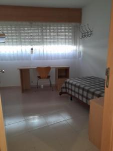 Ένα ή περισσότερα κρεβάτια σε δωμάτιο στο Micampus Lugo Student Residence