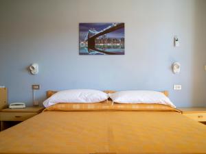 Postel nebo postele na pokoji v ubytování Hotel Quattro Palme + 37 fotografií