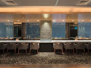 a bar in a hotel with a view of the city at Shinjuku Prince Hotel in Tokyo