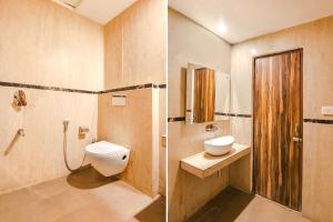 a bathroom with a toilet and a sink and a shower at FabHotel Sallow Grand in Amritsar