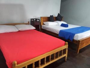 Postel nebo postele na pokoji v ubytování Himansa Homestay