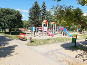 a park with a playground with a slide at Apartament Parkowa 2 in Morąg