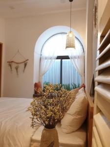 Postel nebo postele na pokoji v ubytování Nest House Homestay