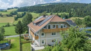 an aerial view of a house with solar panels on its roof at Apartment Eden Wengerkopf in Tamsweg