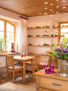 a dining room with a table and chairs at Gasthof Deutscher Adler und Hotel Puchtler in Bischofsgrün +24 photos