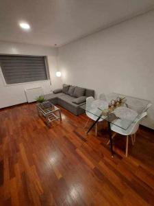 a living room with a couch and a table at Apartamentos Florida Casablanca in Vigo