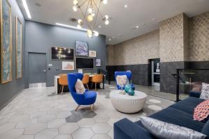 a living room with blue furniture and a fireplace at Downtown 1BR w Pool Gym nr Staples Center LAX-624 in Los Angeles