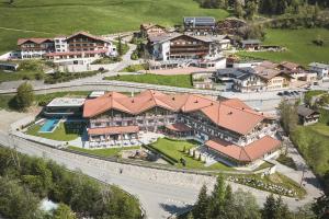 an aerial view of a large estate with houses at Wellness-Sporthotel Ratschings in Racines